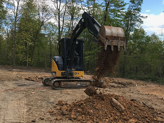 Bulldozer digging dirt.
